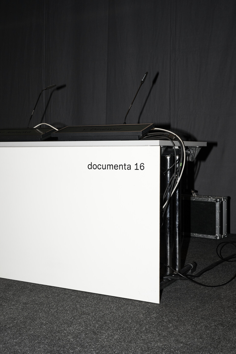 A speakers podium can be seen, on the front is written documenta 16